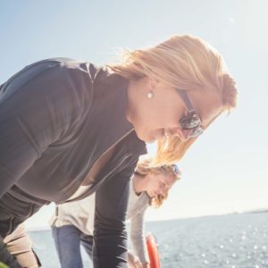 blonde female tying line