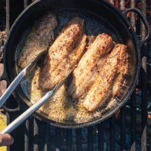 fish cooking on fire